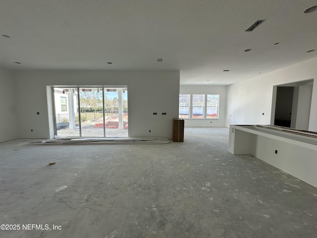 interior space with visible vents and a textured ceiling