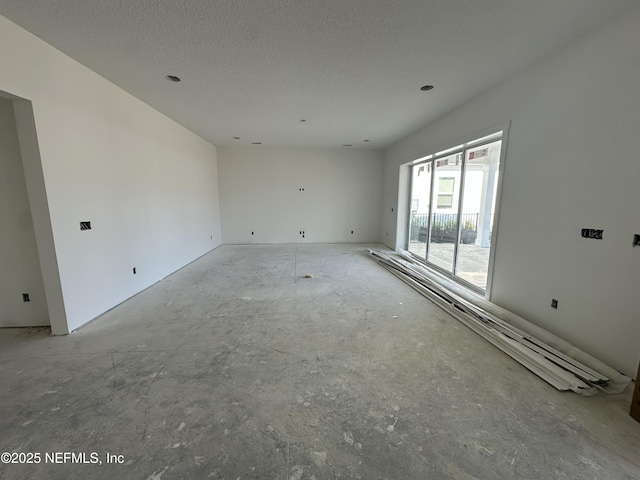 empty room with a textured ceiling