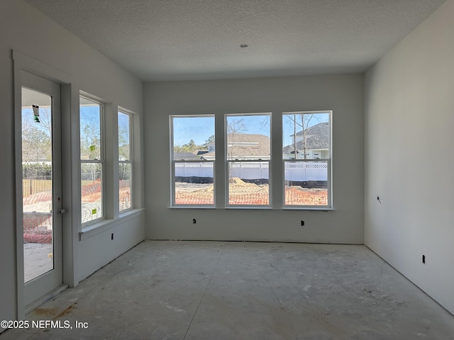 spare room featuring a textured ceiling