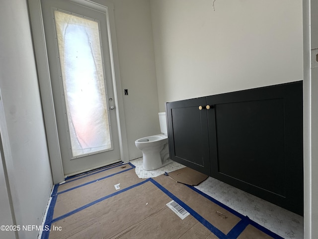 bathroom featuring visible vents and toilet