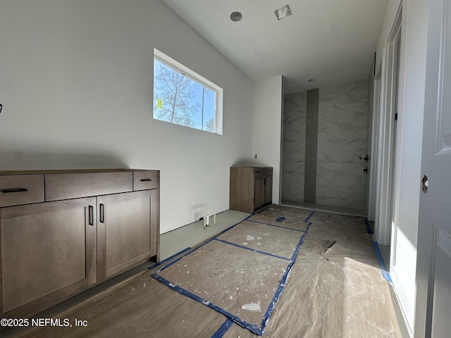 bathroom featuring a textured ceiling