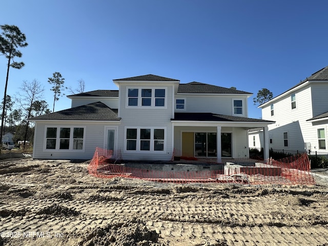 rear view of house with a patio