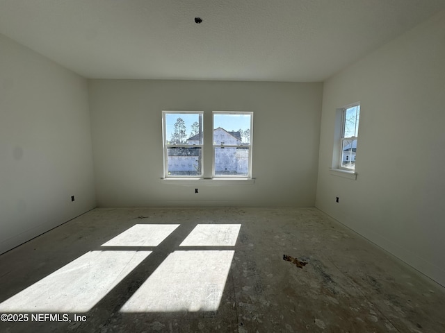 spare room featuring plenty of natural light