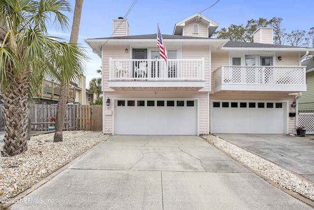 view of front of house with a balcony and a garage