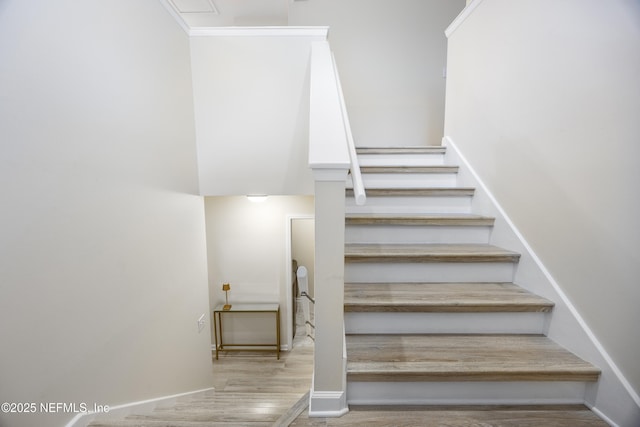 stairs with wood-type flooring