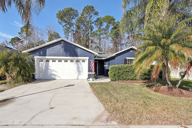 ranch-style home featuring a garage and a front yard