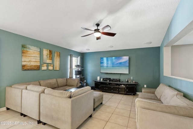 living room with ceiling fan and light tile patterned floors