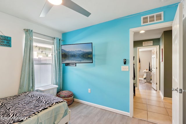 bedroom with light hardwood / wood-style flooring and ceiling fan