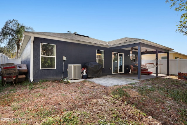 rear view of house with ceiling fan, central AC unit, and a patio