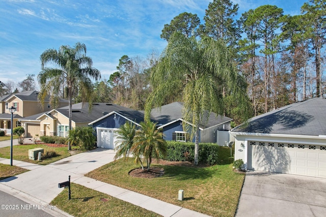 ranch-style home with a garage and a front lawn