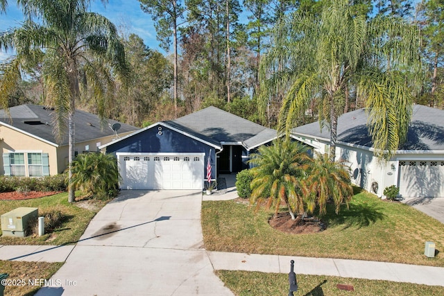 view of front of property featuring a garage and a front lawn