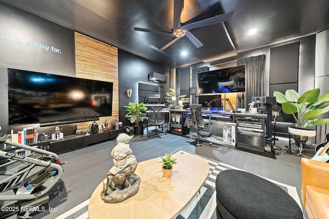 living room featuring an AC wall unit and ceiling fan