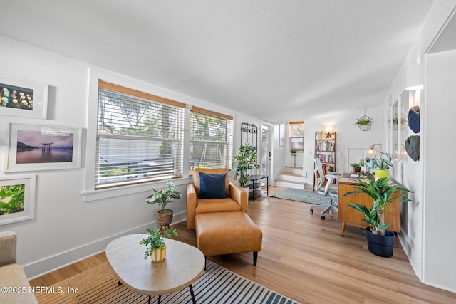 sitting room with light hardwood / wood-style floors