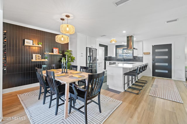 dining room featuring light hardwood / wood-style flooring