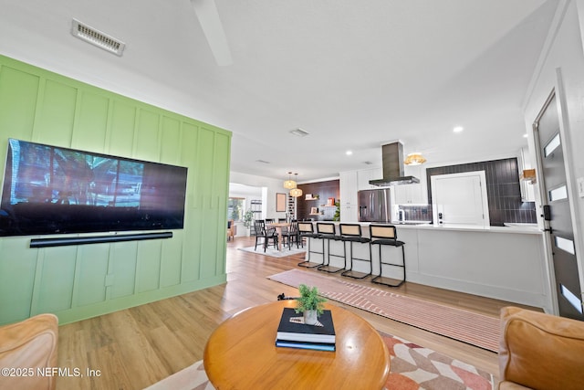 living room featuring light wood-type flooring