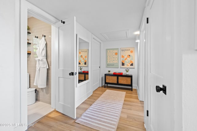 mudroom with light hardwood / wood-style floors