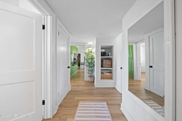 corridor featuring light hardwood / wood-style flooring