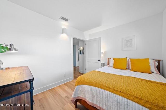 bedroom featuring wood-type flooring