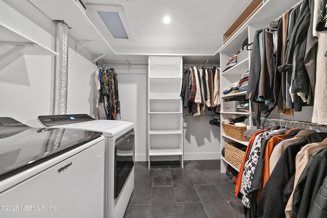 walk in closet with washing machine and dryer