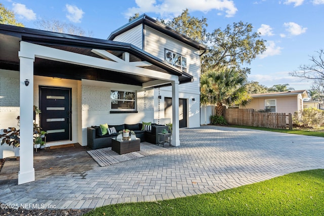 exterior space featuring outdoor lounge area and a patio area