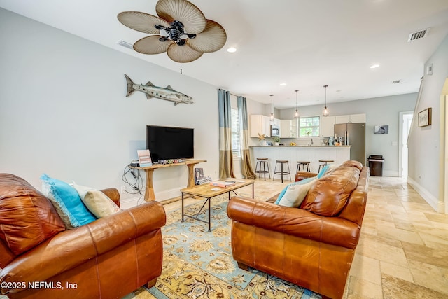 living room with ceiling fan