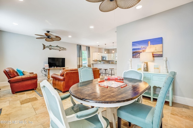 dining room with ceiling fan