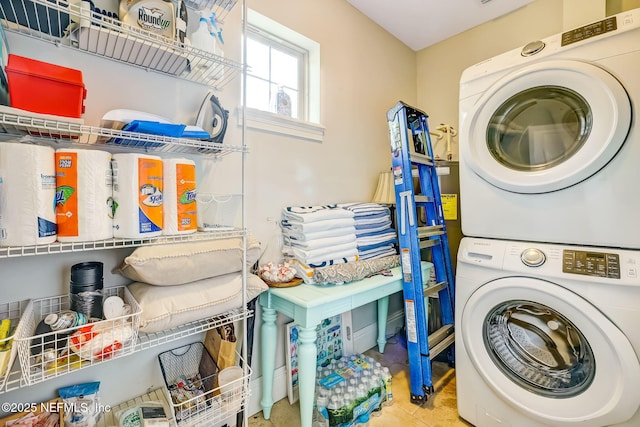 laundry area with stacked washer and clothes dryer