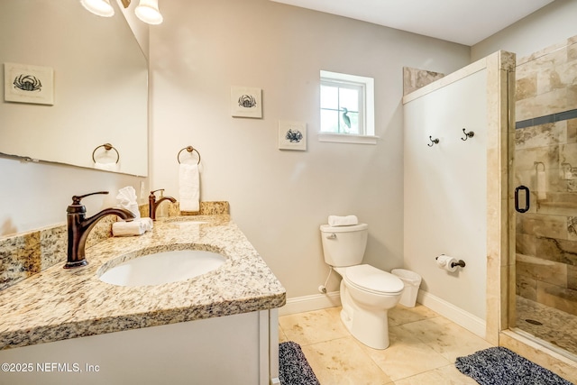 bathroom with vanity, tile patterned flooring, toilet, and walk in shower