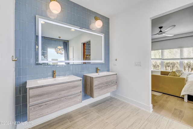 bathroom with vanity, tile walls, and ceiling fan