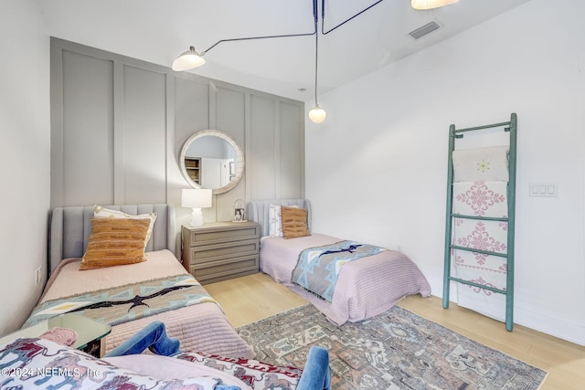 bedroom with light wood-type flooring