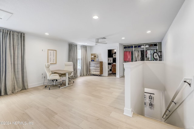 dining space with ceiling fan and light hardwood / wood-style floors