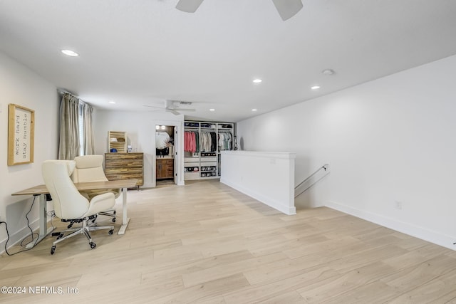 sitting room with light hardwood / wood-style flooring and ceiling fan