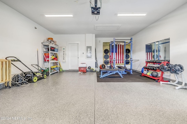 garage featuring a garage door opener and electric panel