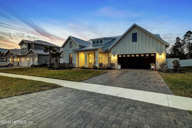 modern farmhouse style home with a yard