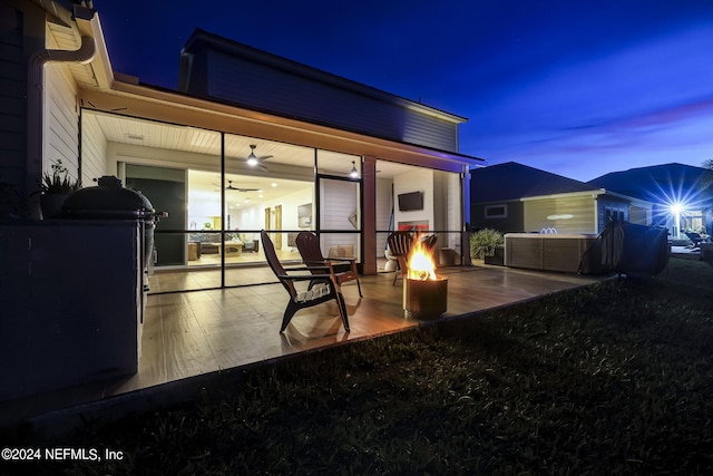 view of patio / terrace featuring an outdoor fire pit