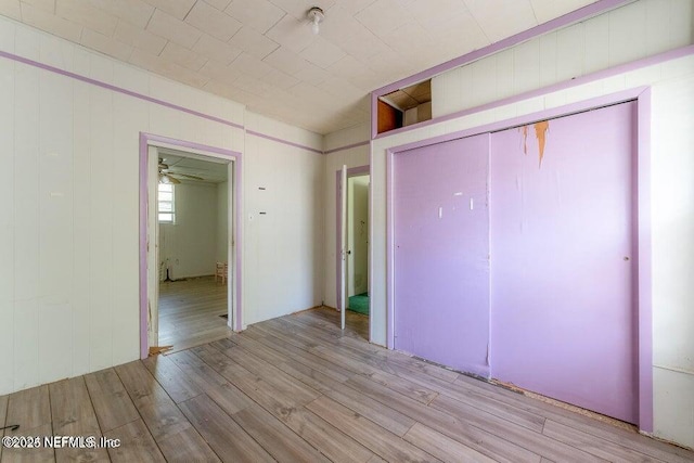 unfurnished bedroom featuring light wood-type flooring