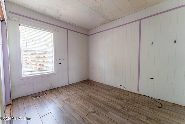 spare room with light wood-type flooring