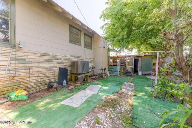 view of yard with central AC unit