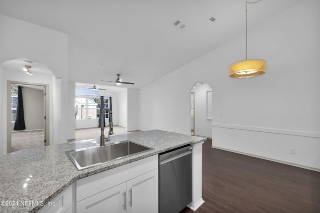 kitchen featuring pendant lighting, sink, white cabinets, stainless steel dishwasher, and dark wood-type flooring