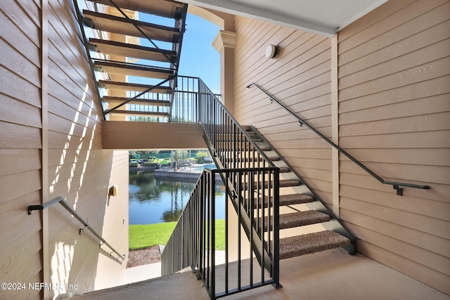 stairway featuring a water view