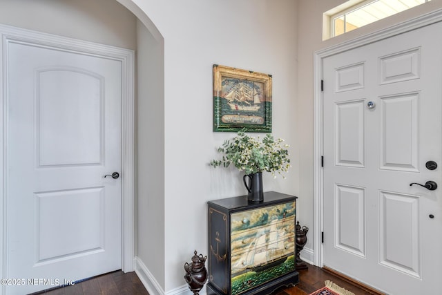 foyer entrance with dark hardwood / wood-style floors