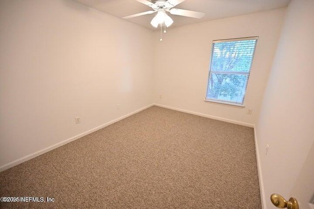 spare room featuring carpet floors and ceiling fan