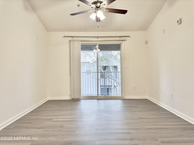 empty room with hardwood / wood-style flooring and ceiling fan