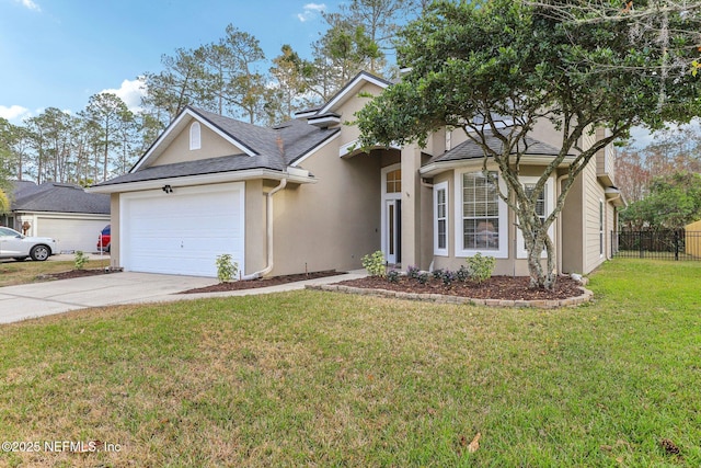 view of front of property featuring a garage and a front lawn