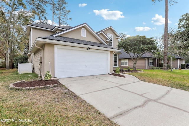 view of front of house with a garage and a front yard