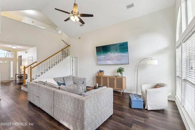 living room with dark wood-type flooring, high vaulted ceiling, and ceiling fan