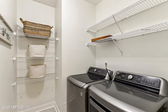 laundry room featuring washer and clothes dryer