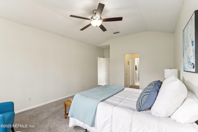 bedroom with ceiling fan, lofted ceiling, and carpet