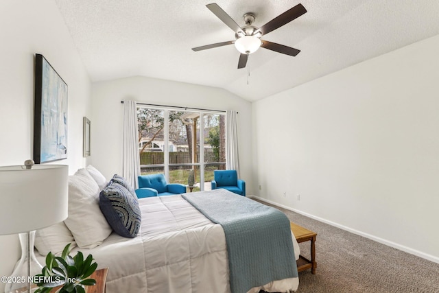 carpeted bedroom with ceiling fan, vaulted ceiling, and a textured ceiling