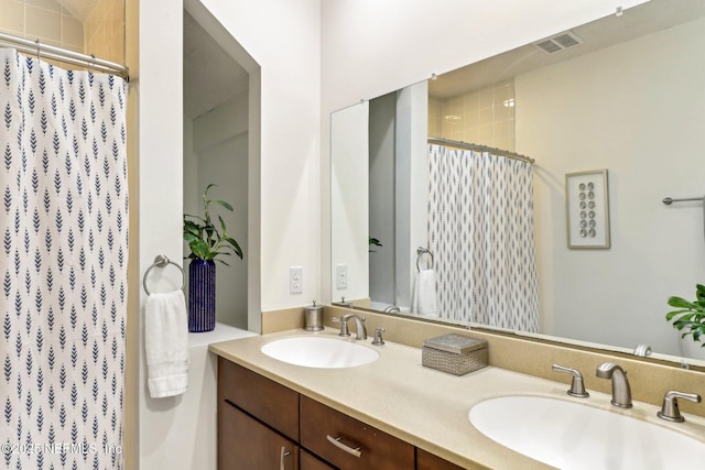 bathroom with vanity and a shower with shower curtain